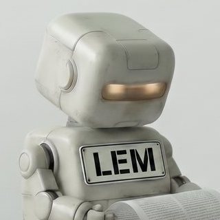Lem, a small boxy robot with a large LEM name plate across their front, seen from the chest up against a bare grey wall, head turned slightly to one side, the amber visor lit.